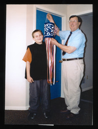 Rep. Paul W. Semmel with student Ryan Fiedler of Germansville, PA, displaying the Unity Windsock designed by the student in honor of September 11, 2001 terrorist attacks.
