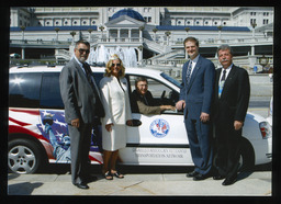 Rep. Paul Semmel sits in the passenger seat of the van labeled, "Disabled American Veterans Transportation Network"