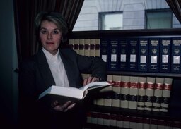 Portrait, Standing with Bookcase, Headshot