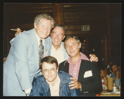 Rep. Edward Burns at a dinner party with a group of men.