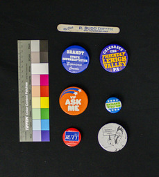 Pins include those campaigning for the House of Representatives, county commissioner. Also includes a pin celebrating Lehigh County, PA and a nail file for Re-elect R. Budd Dwyer for State Treasurer.