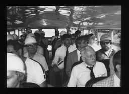 Rep. James L. Wright, Jr. and others on a school bus