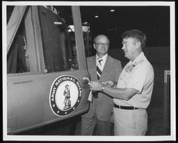 Rep. Kenneth J. Cole near a "Huey" helicopter