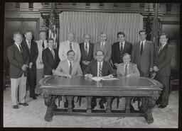 Bill signing ceremony for Do-It-Yourself Month with large group, circa 1980s.