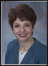 Official Portrait, Rep. Mary Ann Daily wears a turquois sweater.