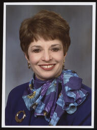 Official Portrait, Rep. Mary Ann Dailey wears a purple shirt and scarf