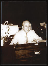 W. Mack Guthrie on the Floor of the House, seated at his desk