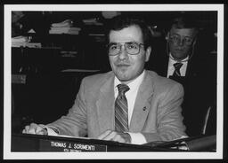 Portrait, Rep. Thomas Scrimenti seated as his desk on the House Floor.