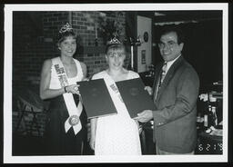 Rep. Thomas Scrimenti presents citations to the Erie County Dairy Princess and Dairy Maid.