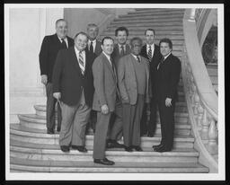 The House and Senate leadership stands on the staircase in the main rotunda.Featured in the front row, left to right: Rep. James Manderino, President Pro Tempore Henry Hager, Rep. K. Leroy Irvis, and Rep. Robert O'Donnell.Featured in the back row, left to right: Senator Eugene Scanlon, Rep. Matthew Ryan, Senator Robert Jubelirer, Rep. Samuel E. Hayes, Jr.